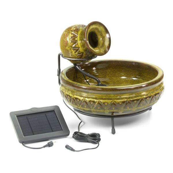 Decorative ceramic water fountain with solar panel on a white background