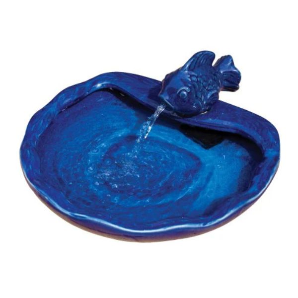 Blue ceramic fish-shaped water fountain on a white background