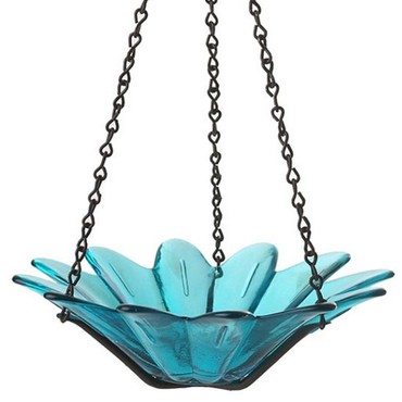 Close-up of the teal glass flower-shaped birdfeeder with clear petals and sturdy black chain