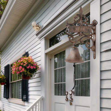 Fleur-de-lis inspired bell for entryways and doors