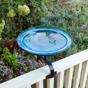Elegant glass bird bath with a 12-inch diameter and 4-inch depth, featuring a solar-powered bubbler that attracts birds and keeps the water fresh. Includes a sturdy aged metal stand for decks, patios, or flat surfaces.