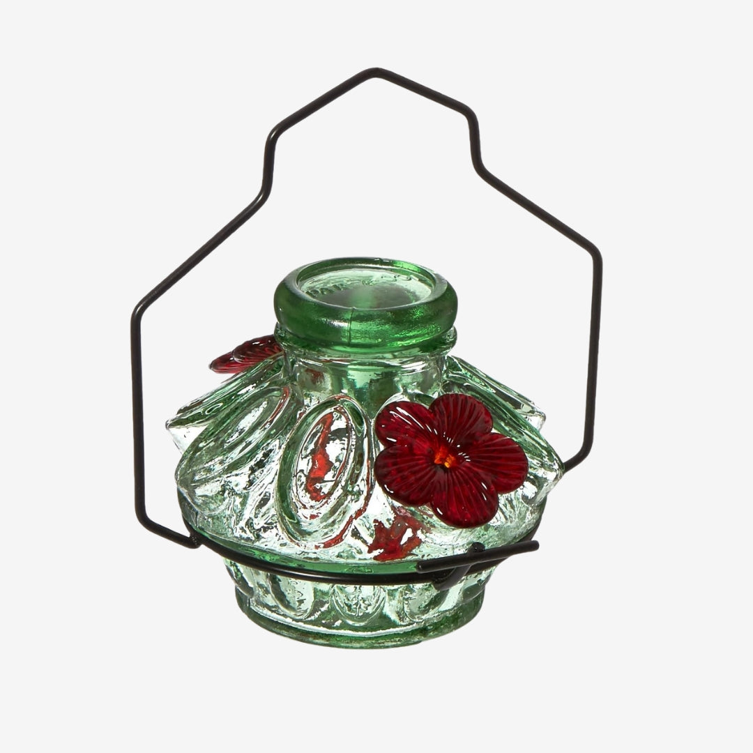 Moon & Stars Hummingbird Feeder with Pot de Creme glass design in green, featuring intricate patterns, two perches, and a 6oz recycled glass reservoir