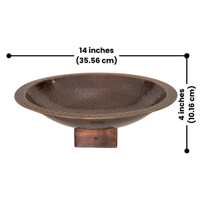 Close-up of the Perch & Ponder Copper Birdbath, showing its 14-inch diameter and 4-inch depth, featuring a hammered copper finish and a wooden post mount.