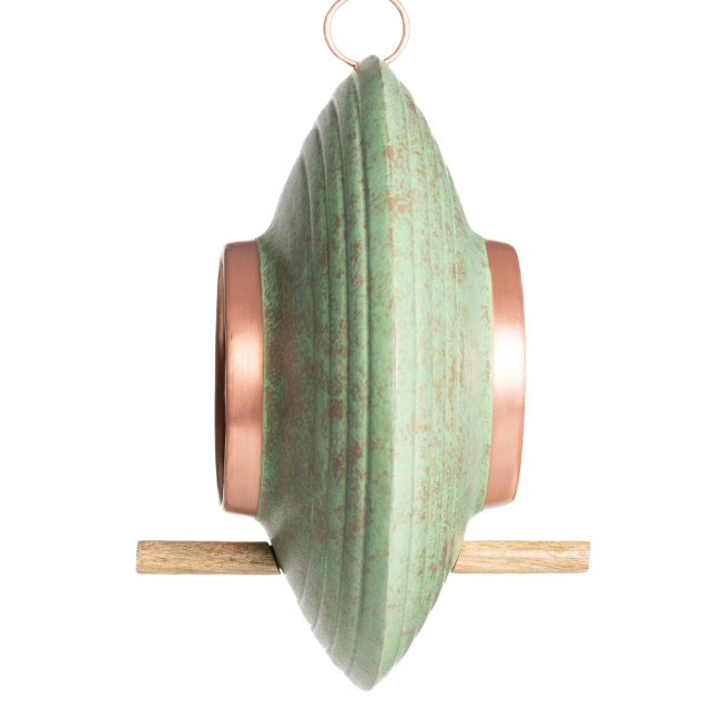 Side view of the Fly-Thru™ feeder highlighting its sculpted oval body, copper accents, and wooden perch for birds.