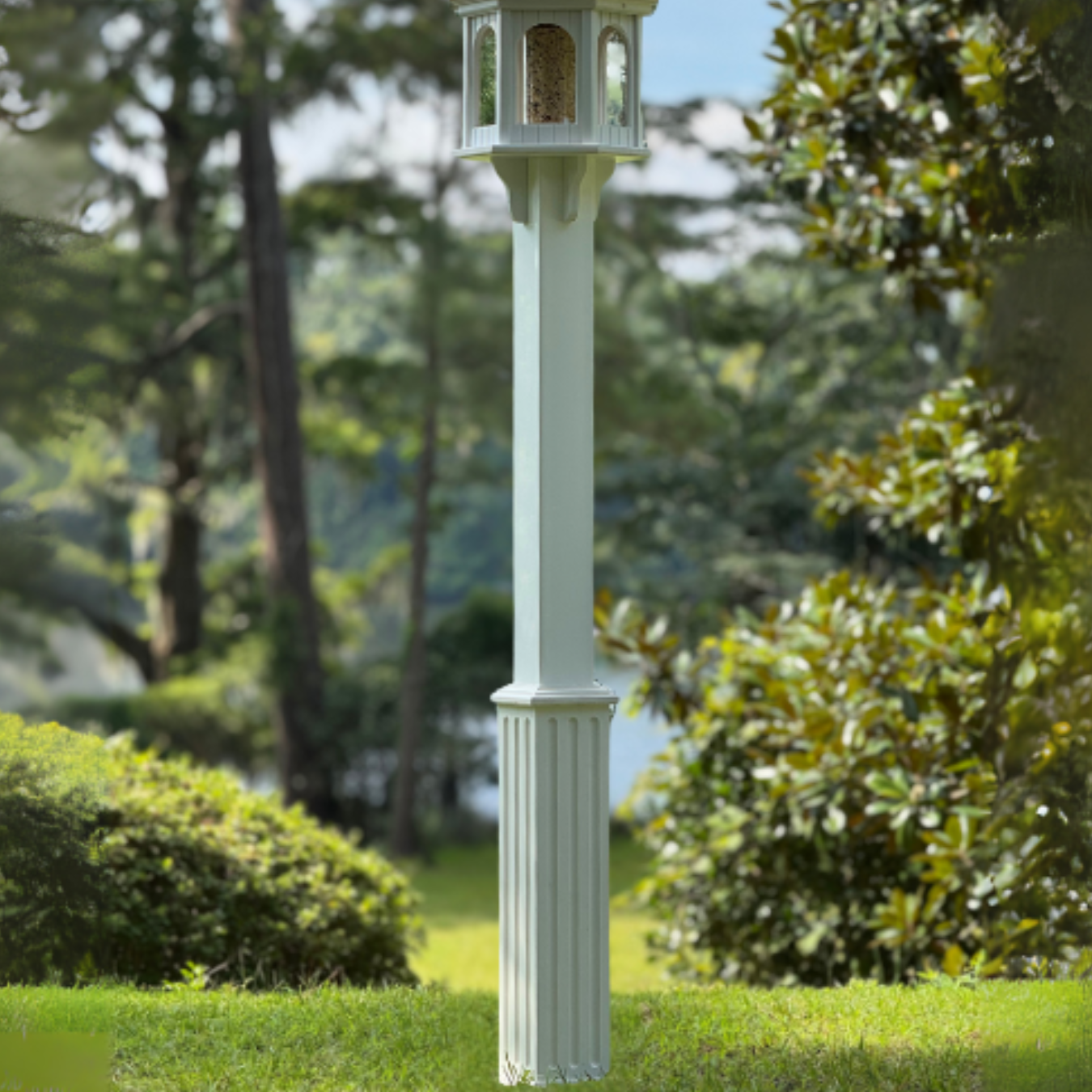 White vinyl post cover with decorative base.  Copper roof feeder on top of the post with a gorgeous North Carolina background