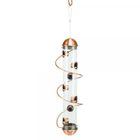 Clear spiral bird feeder with copper accents on a white background