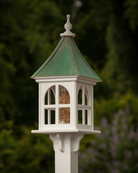 Handcrafted Copper Roof Bird Feeder with Arch Window, made from durable cellular PVC. Features a lift-off roof, 4x9 acrylic tube, and decorative brackets. Maintenance-free with no rotting, cracking, or fading. USA-made, fits 4x4 post. Bright or Patina Copper Roof options. Free shipping!
