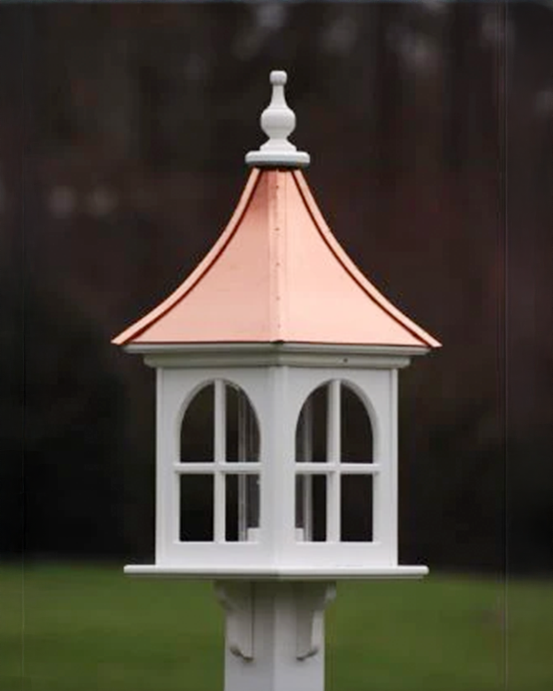 Handcrafted Copper Roof Bird Feeder with Arch Window, made from durable cellular PVC. Features a lift-off roof, 4x9 acrylic tube, and decorative brackets. Maintenance-free with no rotting, cracking, or fading. USA-made, fits 4x4 post. Bright or Patina Copper Roof options. Free shipping!