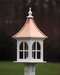 Handcrafted Copper Roof Bird Feeder with Arch Window, made from durable cellular PVC. Features a lift-off roof, 4x9 acrylic tube, and decorative brackets. Maintenance-free with no rotting, cracking, or fading. USA-made, fits 4x4 post. Bright or Patina Copper Roof options. Free shipping!
