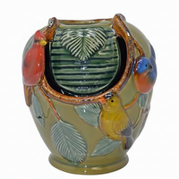 Decorative ceramic vase with bird designs on a white background