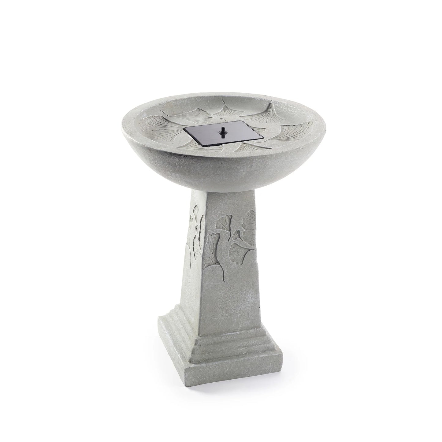 Ginko Tall Solar Bird Bath with a weathered stone finish, featuring ginkgo leaf patterns on the pedestal and a black solar panel centered in the shallow bowl.