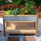 4ft Raised Planter – Cedar & Galvanized Steel – Stylish and durable elevated garden bed for herbs, flowers, and vegetables. Weather-resistant cedar frame with corrugated galvanized steel panels for a modern, rustic look. Spacious 4.86 cu. ft. planting bed with included fabric liner. Lower slatted shelf provides 8 sq. ft. of storage. Easy assembly with Phillips-head screws. Measures 48"L x 22"W x 33.5"H. Perfect for patios, decks, and backyards.