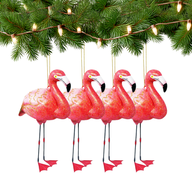 Four pink flamingo ornaments hanging under a Christmas tree with lights.