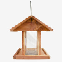 Eco-friendly Amish Made Cedar Hopper Feeder with a seed cylinder, ideal for backyard birdwatching and feeding