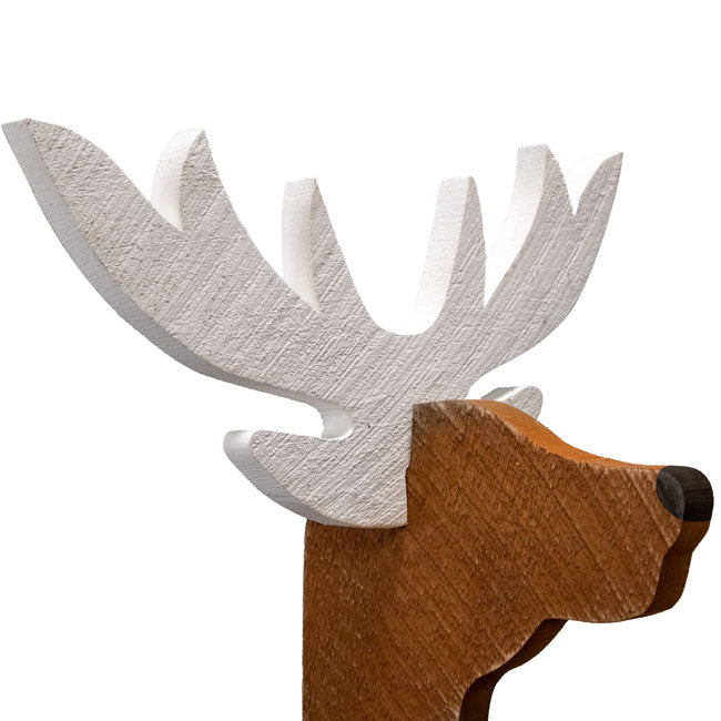 Wooden deer head with antlers on a white background