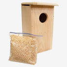 Coveside premium nesting box on a tree, crafted from durable cedar to attract screech owls and kestrels, providing a secure and weatherproof wildlife shelter.