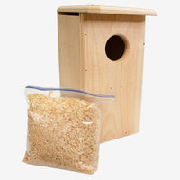 Coveside premium nesting box on a tree, crafted from durable cedar to attract screech owls and kestrels, providing a secure and weatherproof wildlife shelter.
