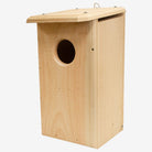 Coveside premium nesting box on a tree, crafted from durable cedar to attract screech owls and kestrels, providing a secure and weatherproof wildlife shelter.