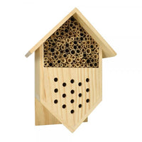 Wooden bee house with cylindrical holes on a white background