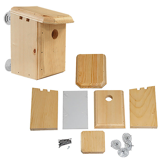 Wooden birdhouse kit with all parts on a white background