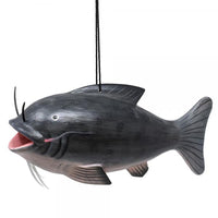 Black catfish-shaped bird feeder hanging against a white background