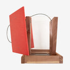 Handmade Amish Cedar and Recycled Plastic Hopper Bird Feeder with a red roof, built for durability and eco-friendly bird feeding