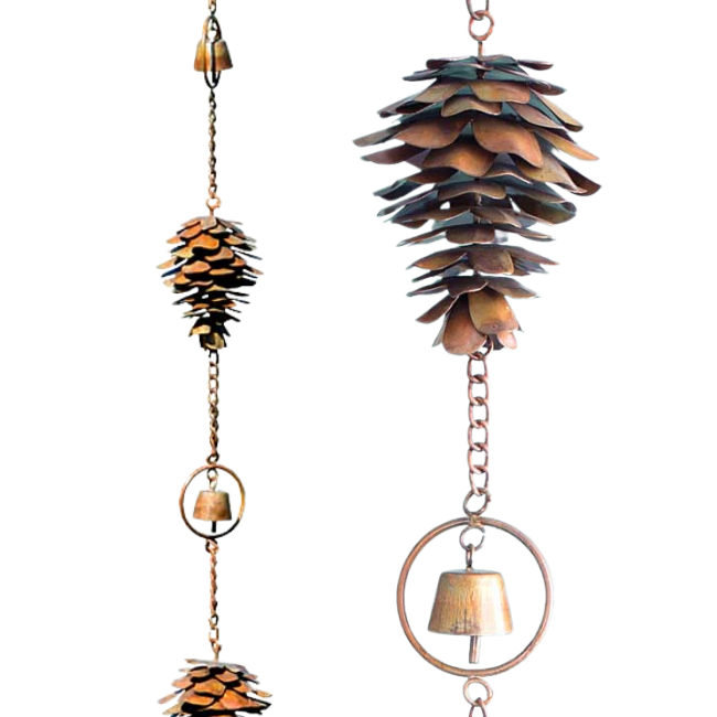 Close-up of a single copper pine cone with flamed copper finish and a bell in the middle, hanging on a chain.