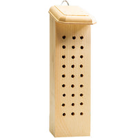 Wooden bee house with holes on a white background
