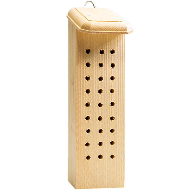 Wooden bee house with holes on a white background