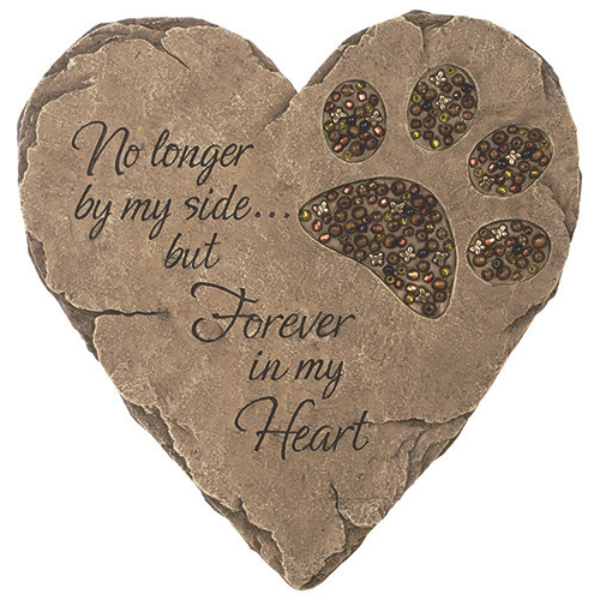 Heart-shaped pet memorial stone with paw print and text on a white background