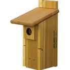 Wooden birdhouse with a slanted roof on a white background