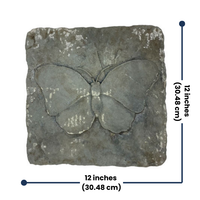 Close-up of a concrete stepping stone with a finely detailed butterfly design, showcasing its durable construction and gray finish for outdoor use.