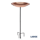 Sculptural copper bird bath with a 36-inch steel pole, offering a comfortable perch for birds. The 2-inch deep bath is ideal for safe bird bathing. Available in medium or large size