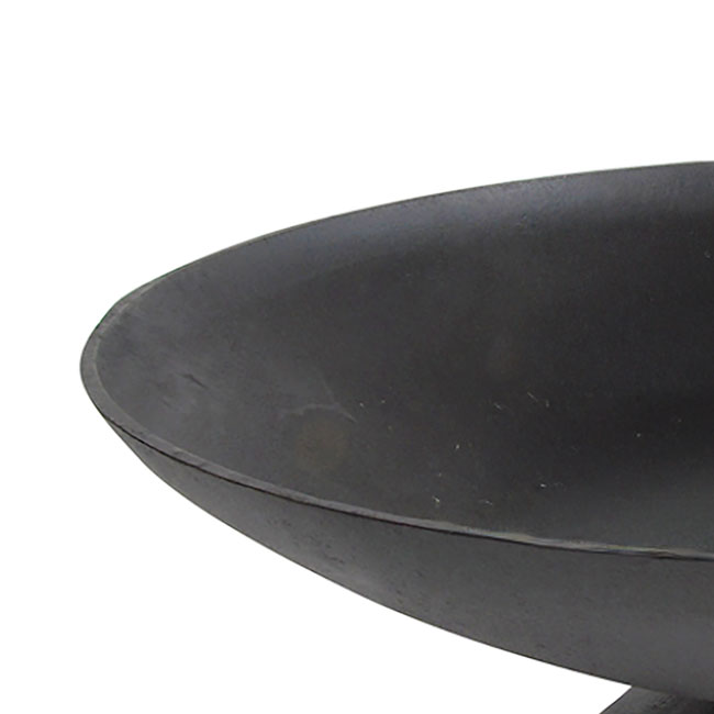 Close-up of a large, round black iron bowl with a smooth, matte finish. The minimalist design conveys simplicity and elegance.