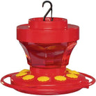 Red and yellow hummingbird feeder with a hook on a white background