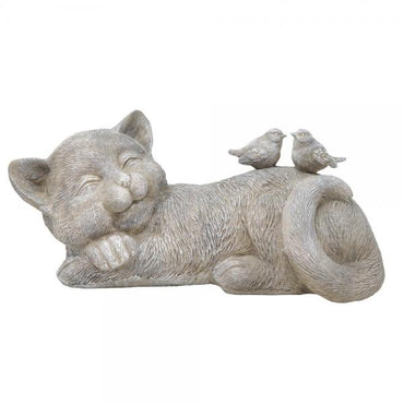 Statue of a cat lying down with two birds on its back against a white background