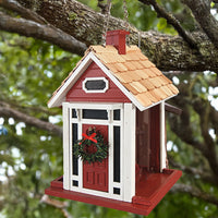 Red Christmas cottage bird feeder by Home Bazaar, designed to attract birds while adding festive charm to your garden.