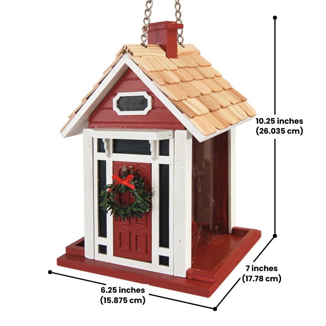 Red Christmas cottage bird feeder by Home Bazaar, designed to attract birds while adding festive charm to your garden.