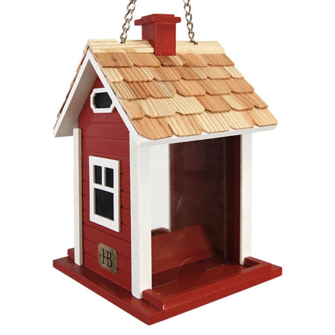 Red Christmas cottage bird feeder by Home Bazaar, designed to attract birds while adding festive charm to your garden.