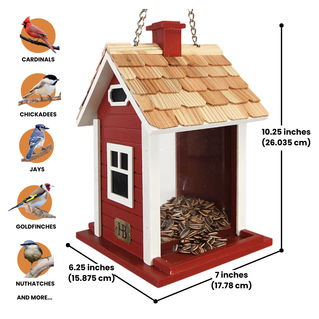 Red Christmas cottage bird feeder by Home Bazaar, designed to attract birds while adding festive charm to your garden.