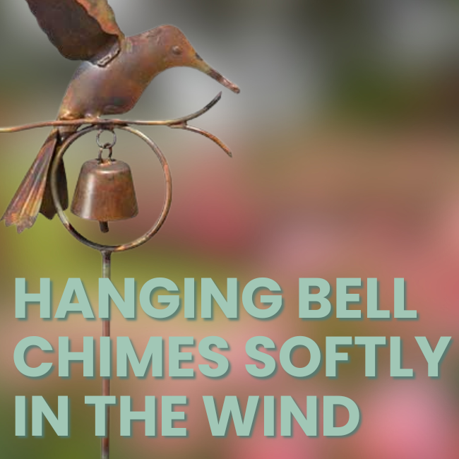 A hummingbird garden stake with a small metal bell that chimes softly in the breeze, creating a peaceful outdoor ambiance.