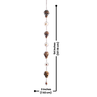 A complete copper pine cone wind chime hanging with multiple pine cones and small bells, creating a peaceful sound. 