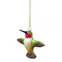 Decorative glass hummingbird ornament on a white background