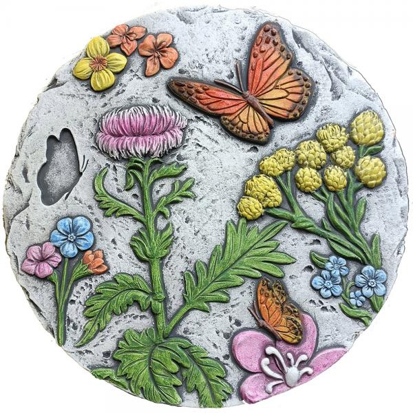 Decorative stone with floral and butterfly designs on a white background
