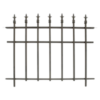 A garden fence with finial-topped bars installed along a garden, providing an elegant and unobtrusive boundary.
