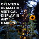 Obelisk Oasis Climbing Trellis with lights creating a dramatic effect at sunset