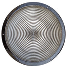 Round metallic birdbath with concentric circular patterns on a white background