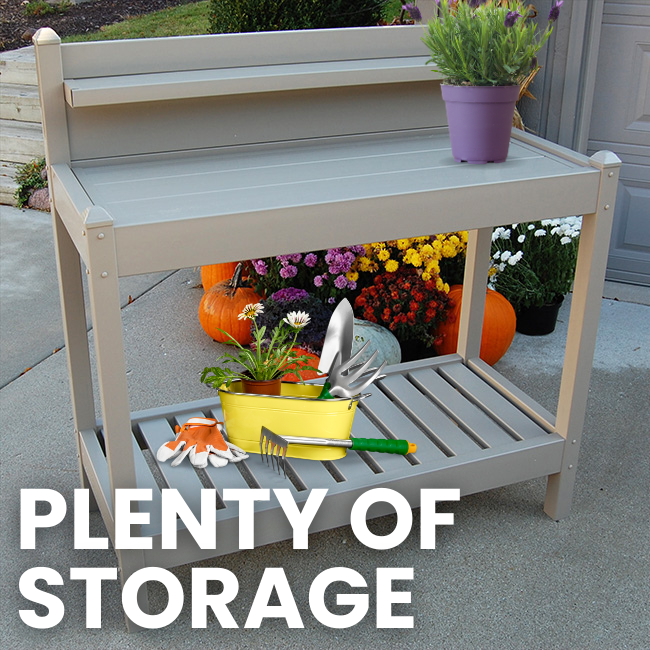 Potting bench offering plenty of storage space, with gardening tools placed on top and a slatted bottom shelf.