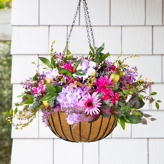 Resin Wicker Hanging Flower Basket with vibrant flowers and cascading greenery. 14" diameter, 7" height with a 16.5" chain for easy hanging installation.