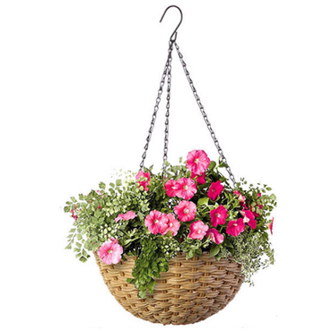 Close-up of Resin Wicker Hanging Flower Basket with pink petunias and green foliage. The 14" diameter basket is perfect for flowers or trailing plants.